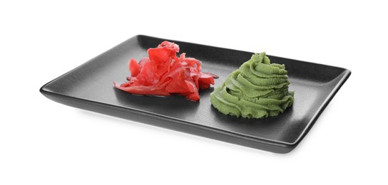 Photo of Plate with swirl of wasabi paste and pickled ginger isolated on white