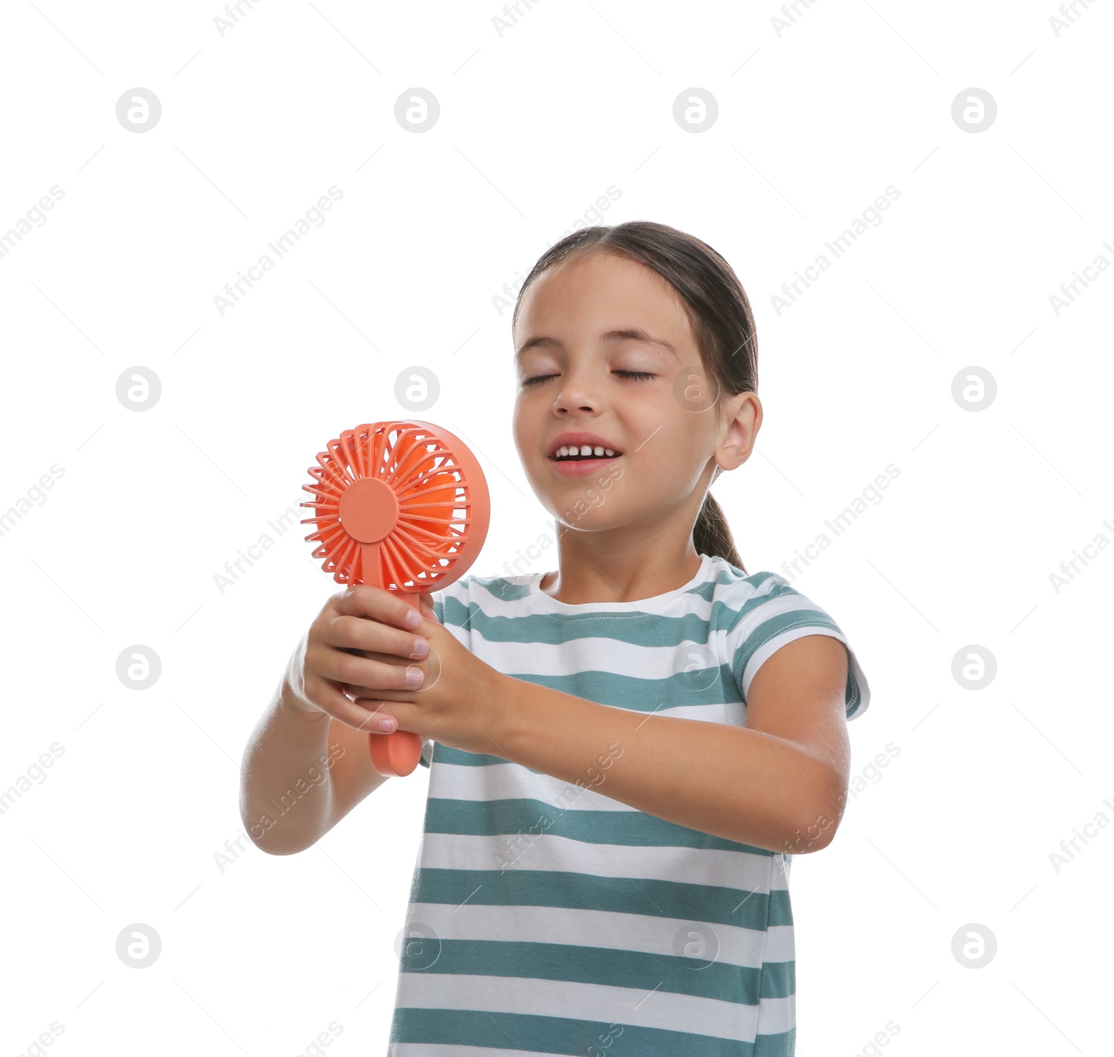 Photo of Little girl enjoying air flow from portable fan on white background. Summer heat