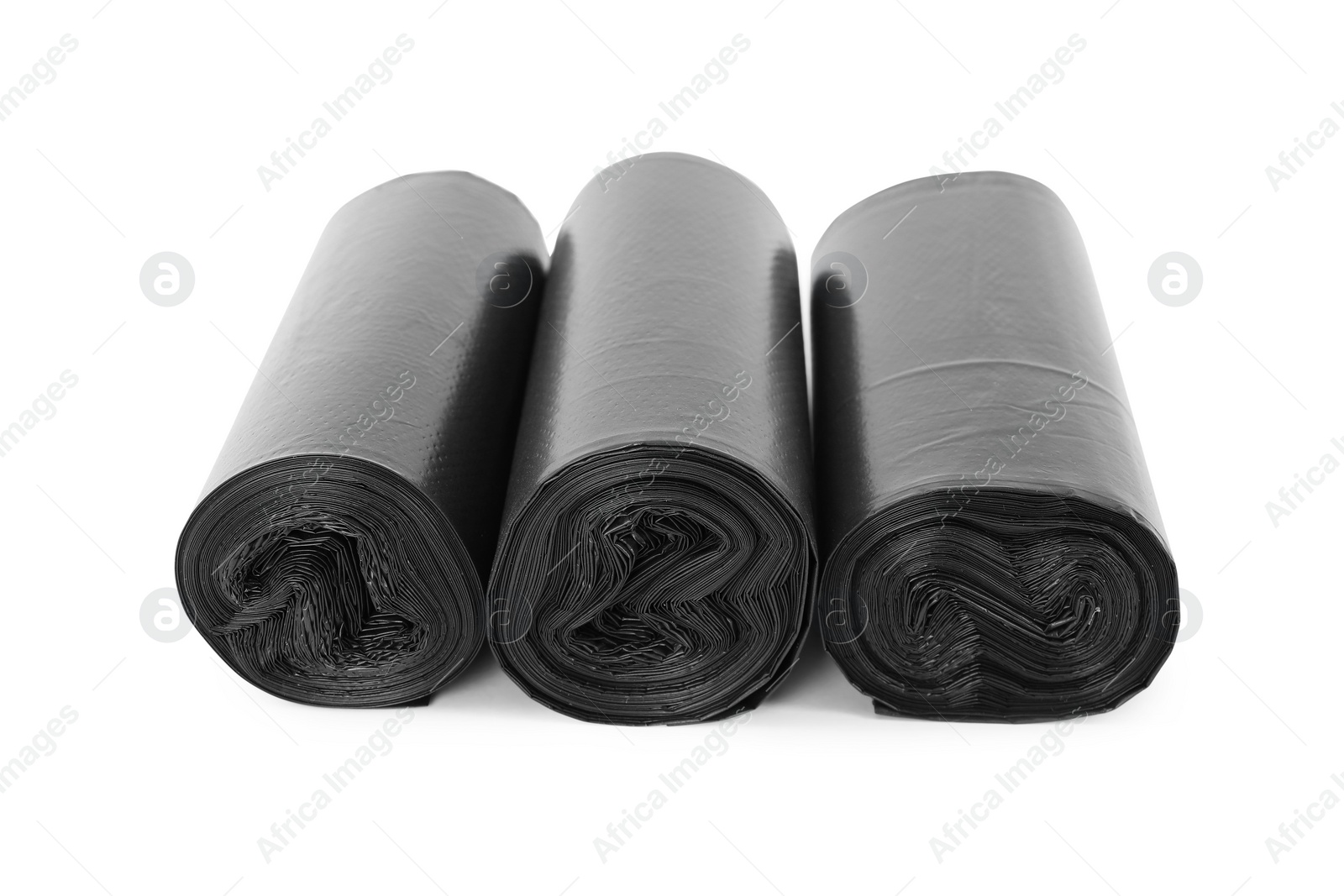 Photo of Rolls of black garbage bags isolated on white