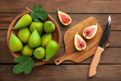 Photo of Cut and whole green figs with knife on wooden table, flat lay