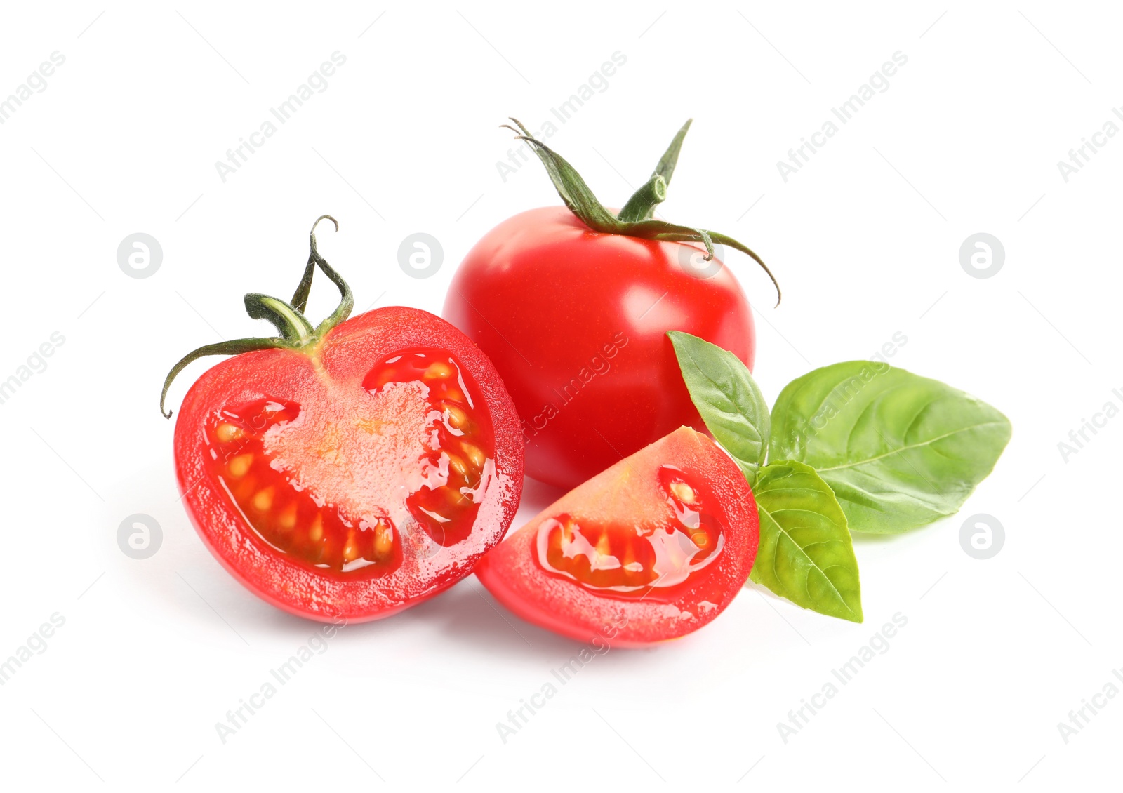 Photo of Fresh cherry tomatoes with basil isolated on white