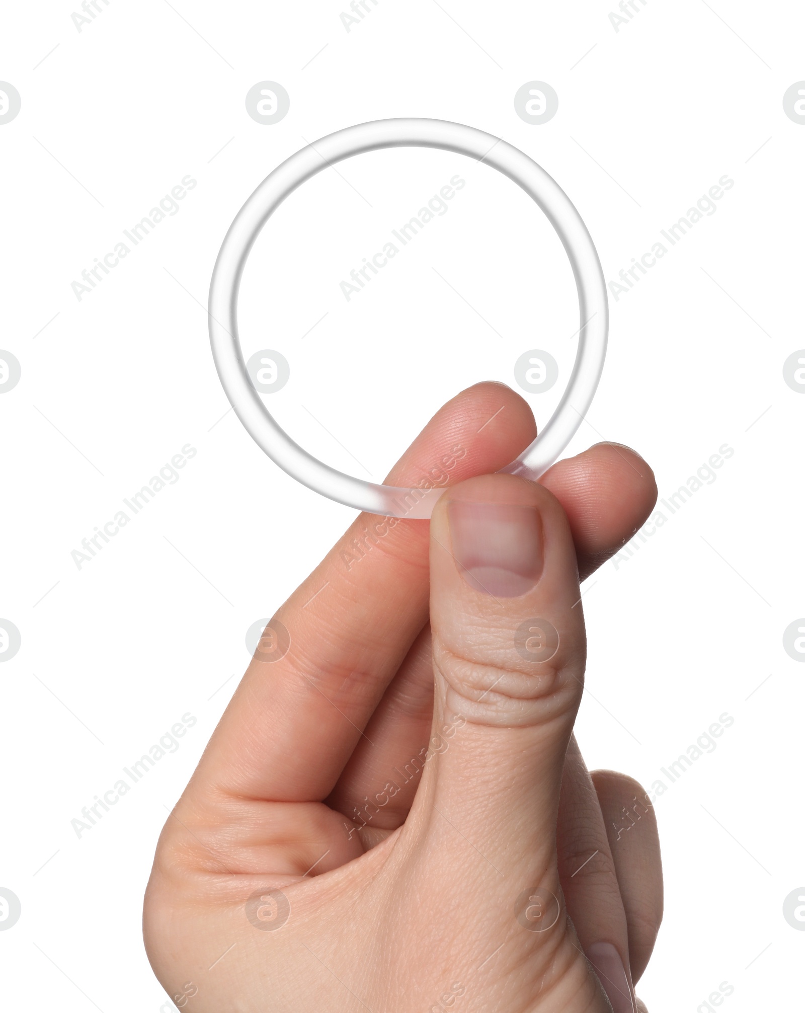 Photo of Woman holding diaphragm vaginal contraceptive ring on white background, closeup