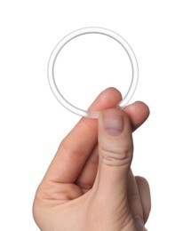 Woman holding diaphragm vaginal contraceptive ring on white background, closeup