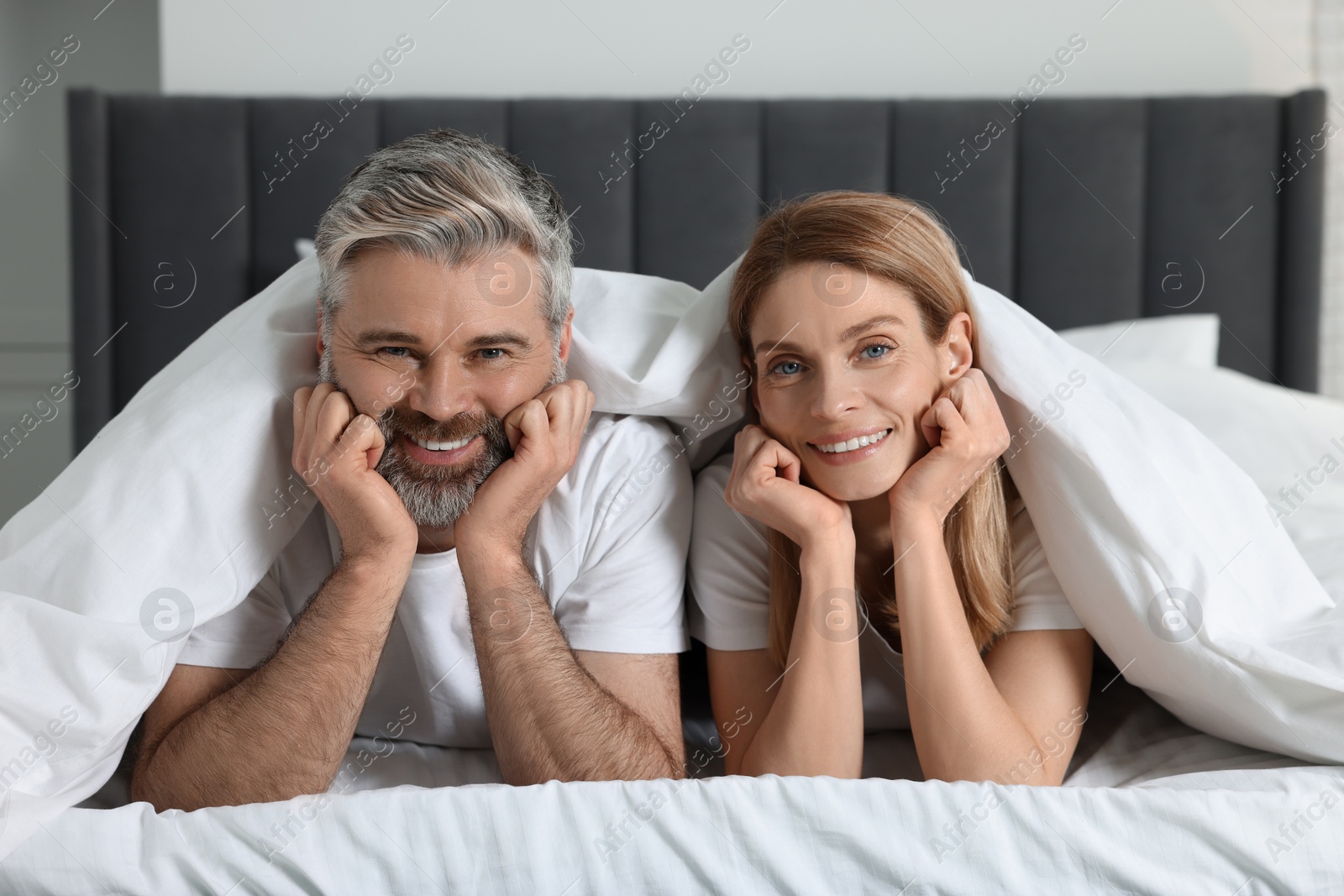 Photo of Lovely mature couple in bed at home