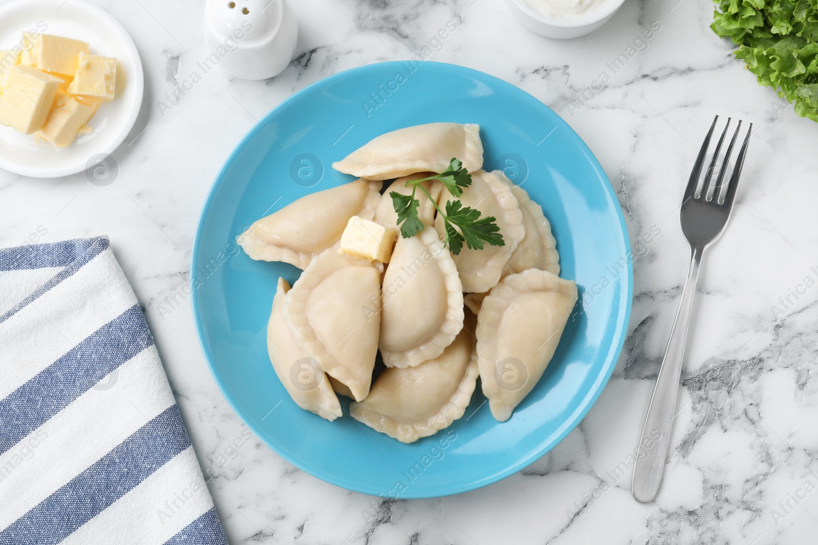 Photo of Flat lay composition with tasty dumplings served on marble table