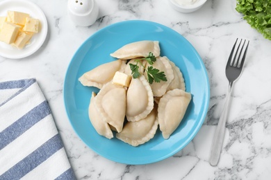 Photo of Flat lay composition with tasty dumplings served on marble table