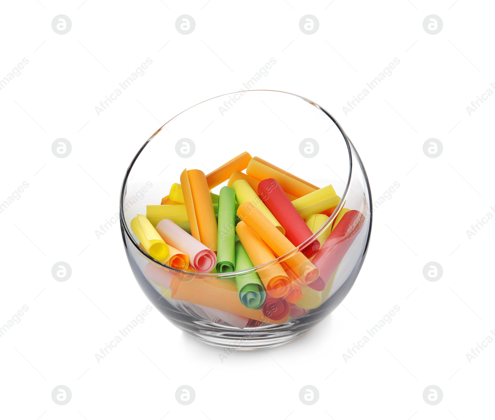 Photo of Colorful paper pieces for lottery in glass vase on white background