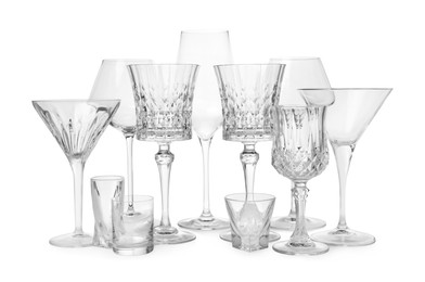 Photo of Different elegant empty glasses isolated on white