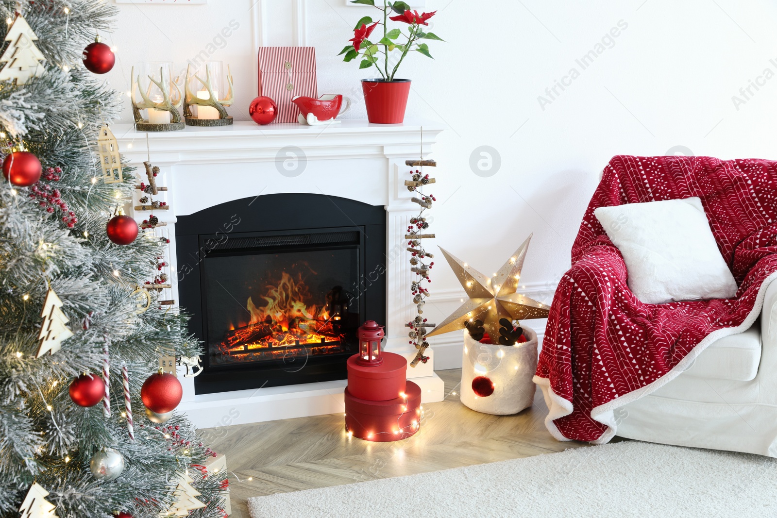 Photo of Living room with fireplace and Christmas decorations. Festive interior design