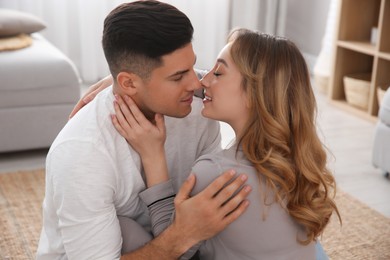 Photo of Lovely couple enjoying time together at home