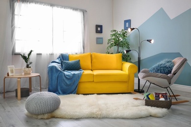 Photo of Stylish living room interior with comfortable sofa