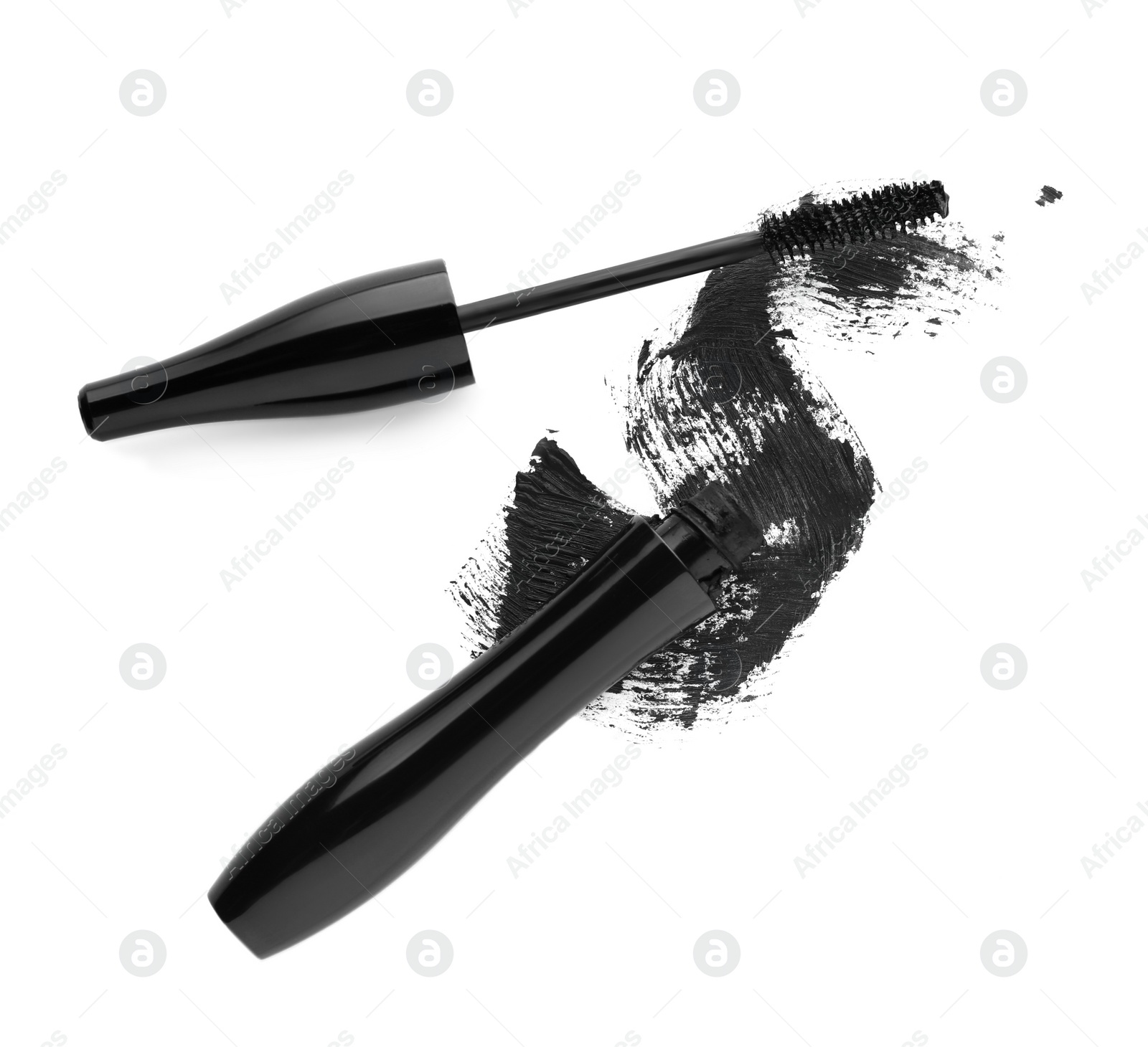 Photo of Applicator, mascara for eyelashes and black smear on white background, top view