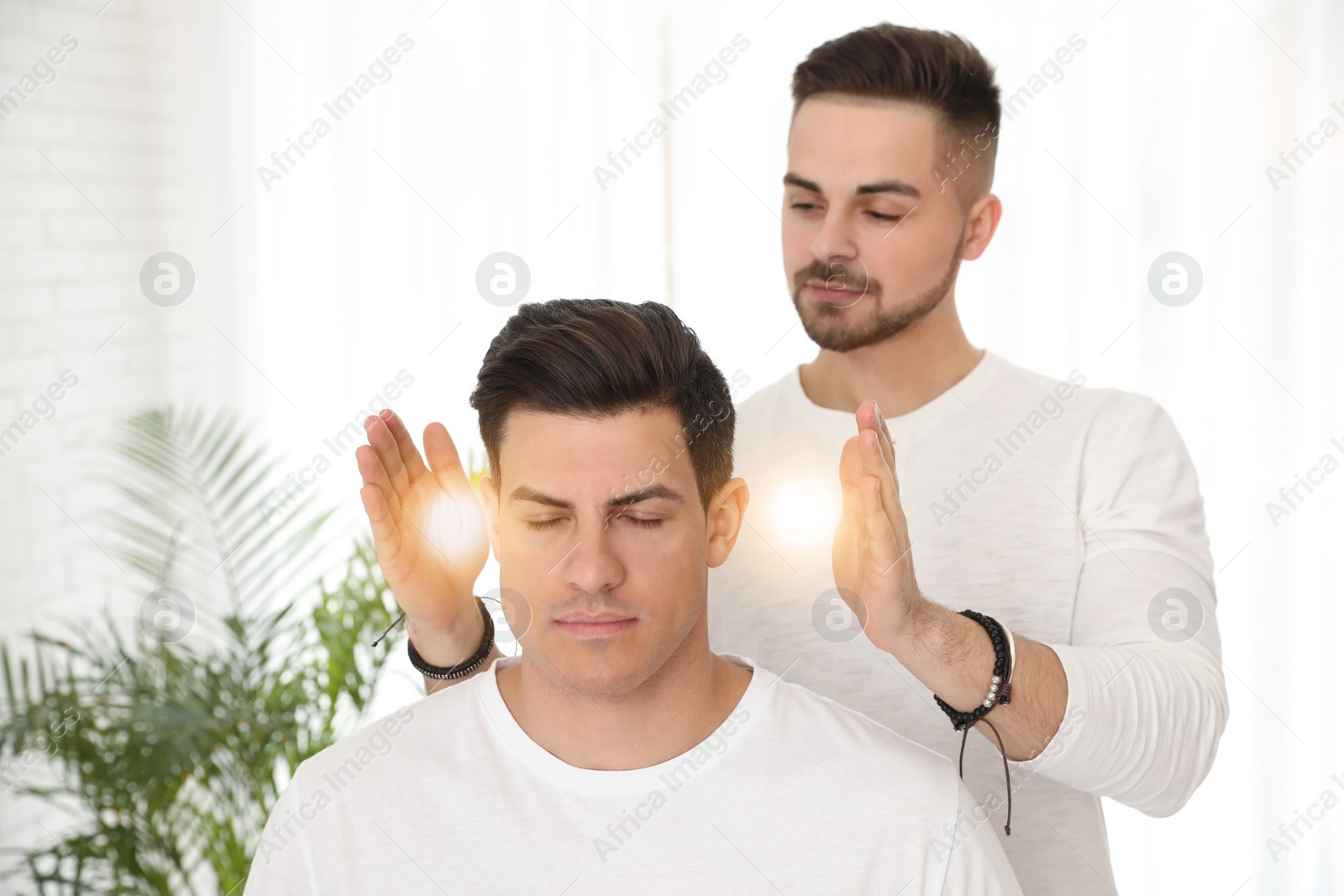 Photo of Man during healing session in therapy room