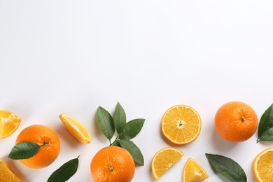 Delicious oranges on white background, flat lay. Space for text