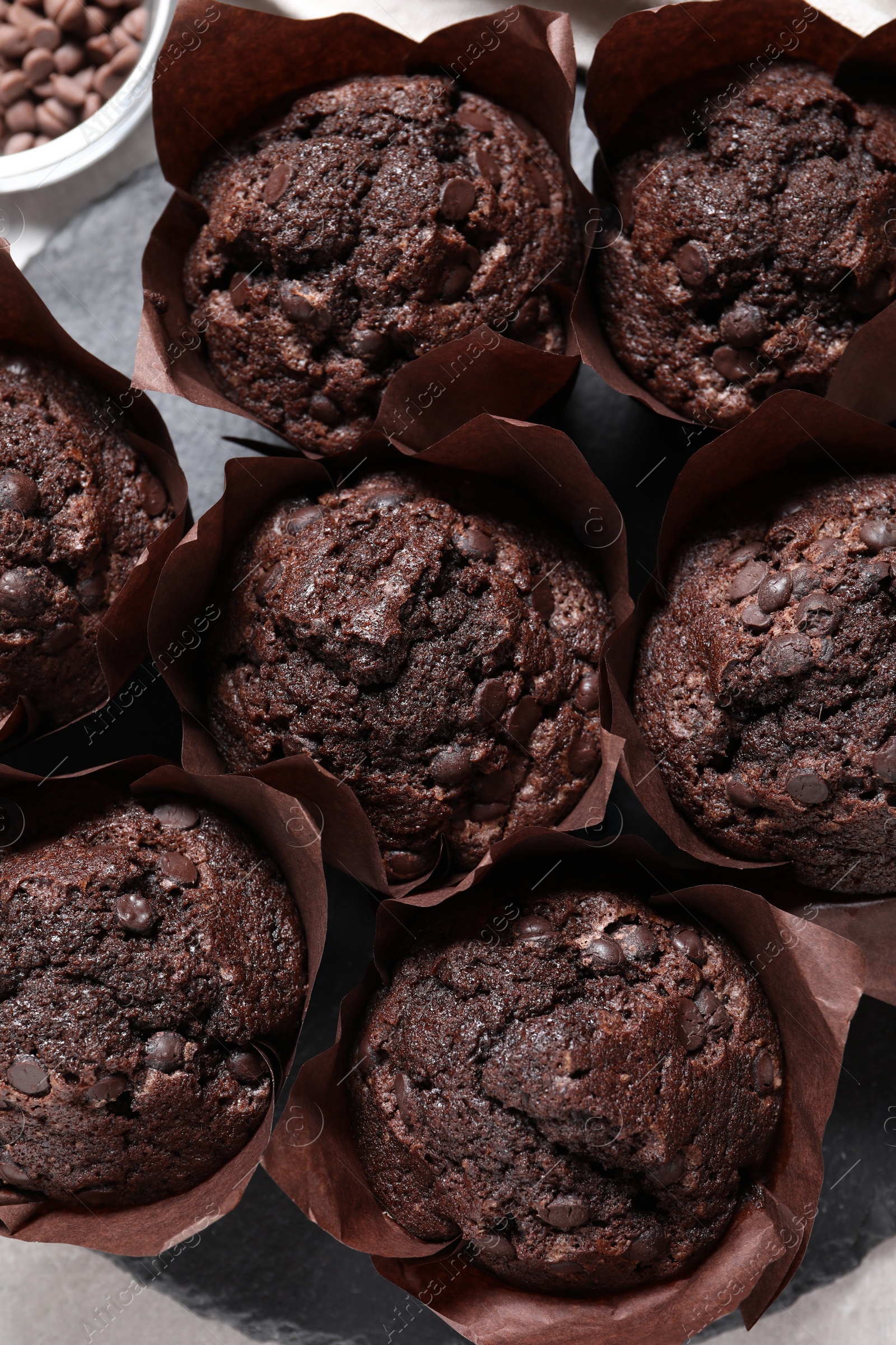 Photo of Tasty chocolate muffins on table, flat lay