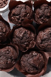 Photo of Tasty chocolate muffins on table, flat lay