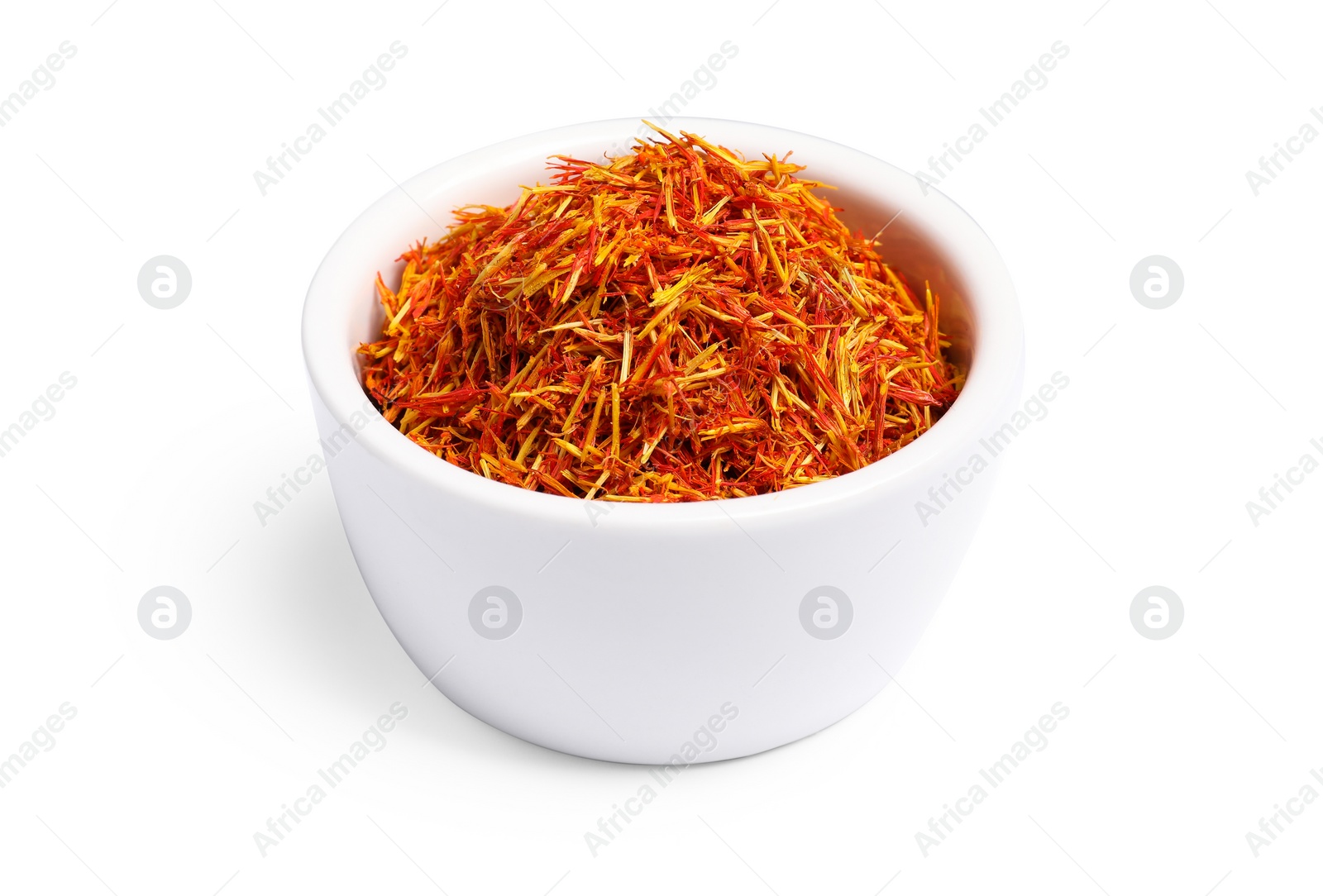 Photo of Aromatic saffron in bowl isolated on white