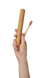 Photo of Woman holding eco friendly bamboo toothbrush and case on white background, closeup. Conscious consumption