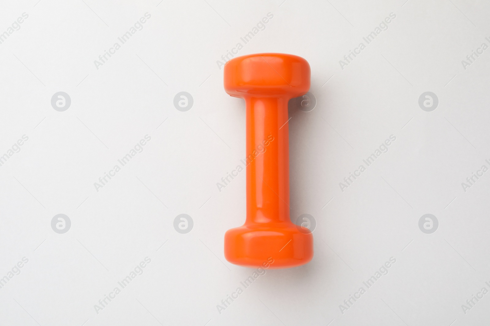 Photo of Orange vinyl dumbbell on light background, top view