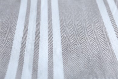 Photo of Texture of grey striped fabric as background, closeup