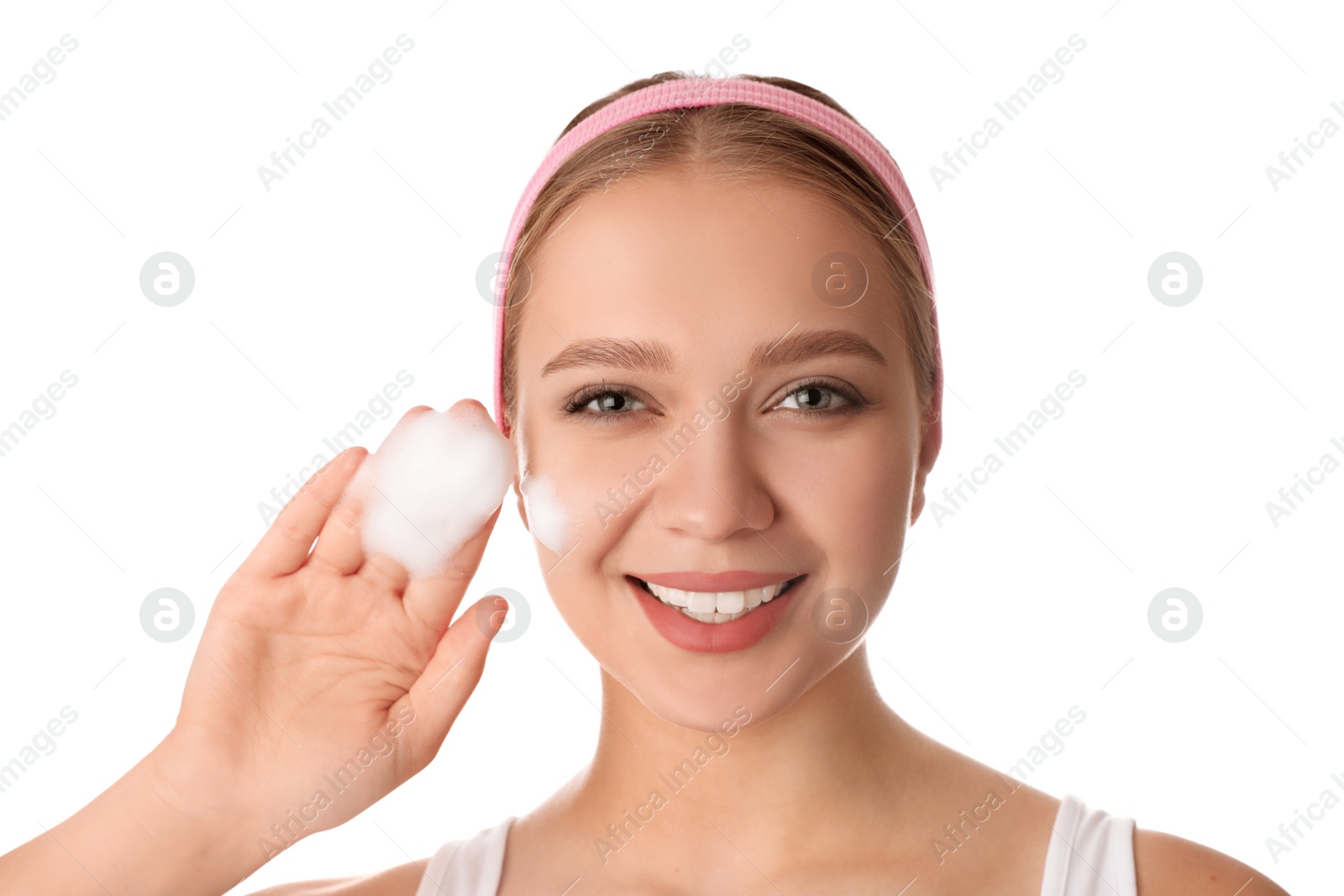 Photo of Young woman washing face with cleansing foam on white background. Cosmetic product