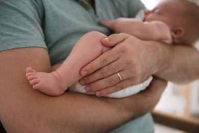 Father with his newborn son, closeup view