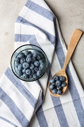 Photo of Flat lay composition with juicy blueberries on color table