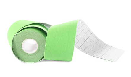 Photo of Green kinesio tape in roll on white background