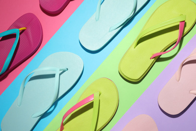 Flat lay composition with flip flops on color background. Beach objects