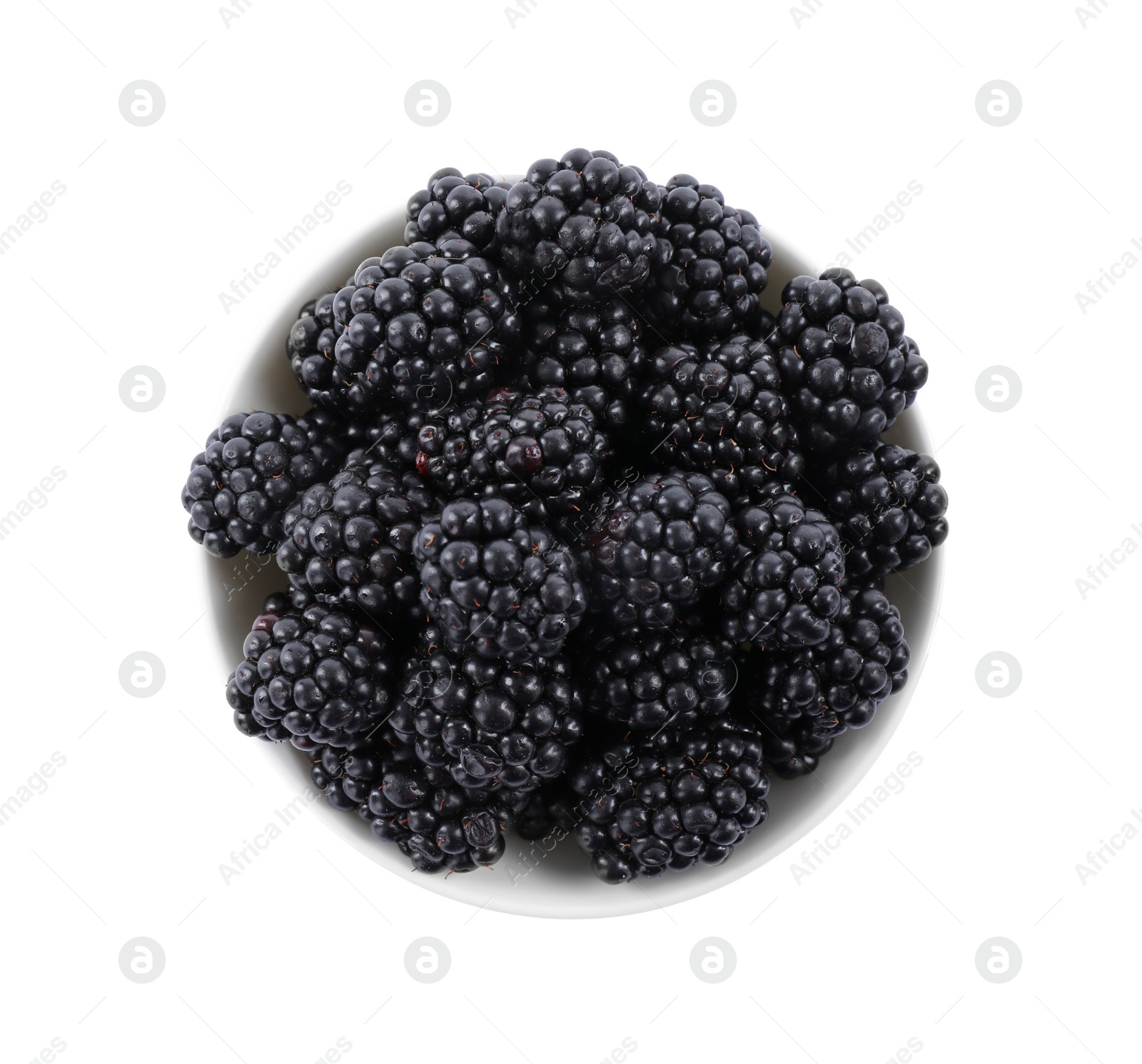 Photo of Fresh ripe blackberries in bowl isolated on white, top view