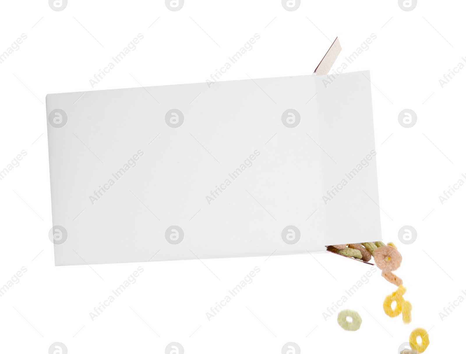 Photo of Pouring tasty cereal rings from paper box on white background