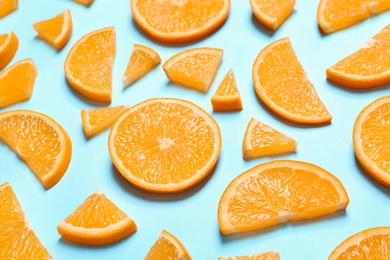 Photo of Composition with orange slices on color background