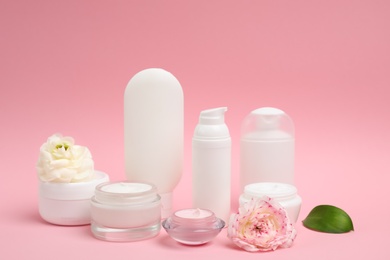 Photo of Composition with cosmetic products on color background