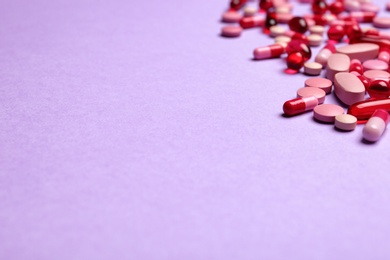 Photo of Different pills and space for text on color background