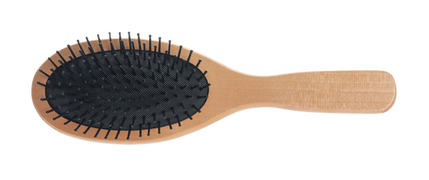 Photo of New wooden hair brush isolated on white, top view