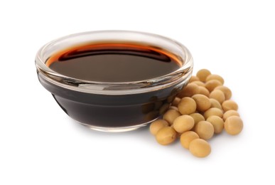 Photo of Bowl of soy sauce and soybeans on white background