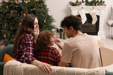Photo of Family with popcorn spending time together at home