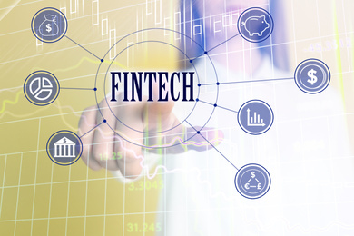Image of Fintech concept. Woman pointing at icon on virtual screen