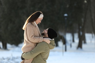 Photo of Beautiful young couple enjoying winter day outdoors