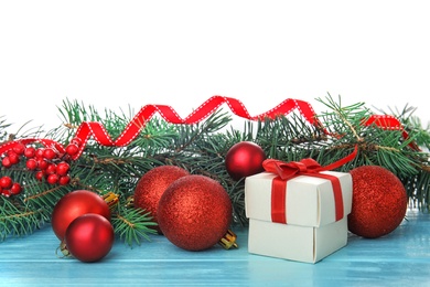 Photo of Beautiful Christmas composition with festive decor and gift box on table against white background