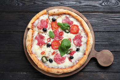 Photo of Delicious pizza Diablo on wooden table, top view