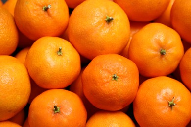 Photo of Delicious fresh ripe tangerines as background, closeup