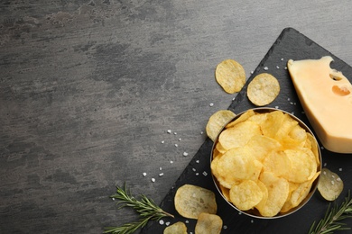 Photo of Flat lay composition with delicious crispy potato chips on table, space for text