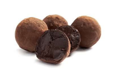Photo of Delicious raw chocolate truffles on white background