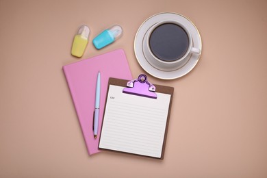 Photo of Mini clipboard with to do notes, planner, stationery and cup of coffee on beige background, flat lay. Space for text