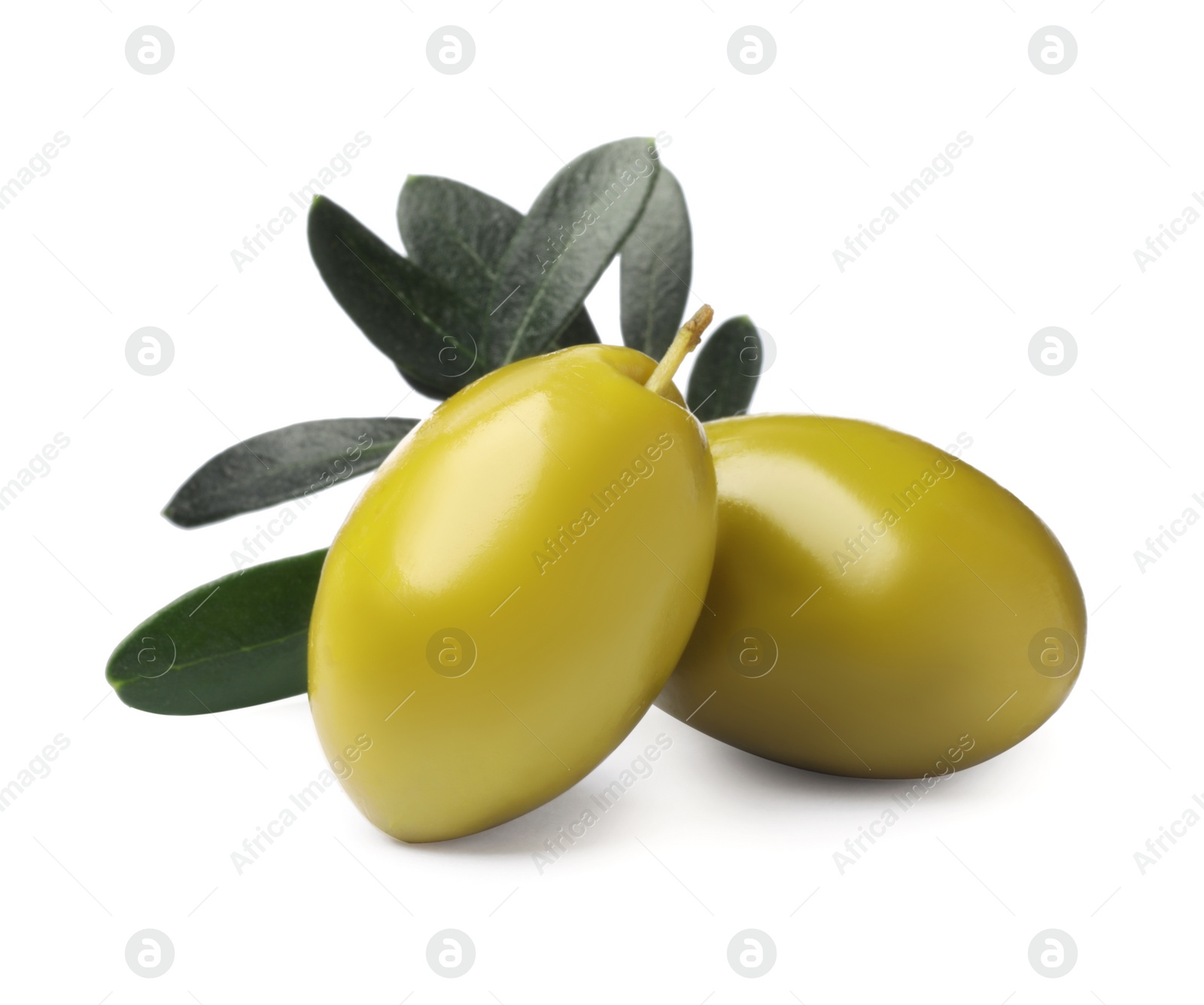 Photo of Olives with green leaves on white background
