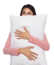 Young woman covering face with pillow on white background