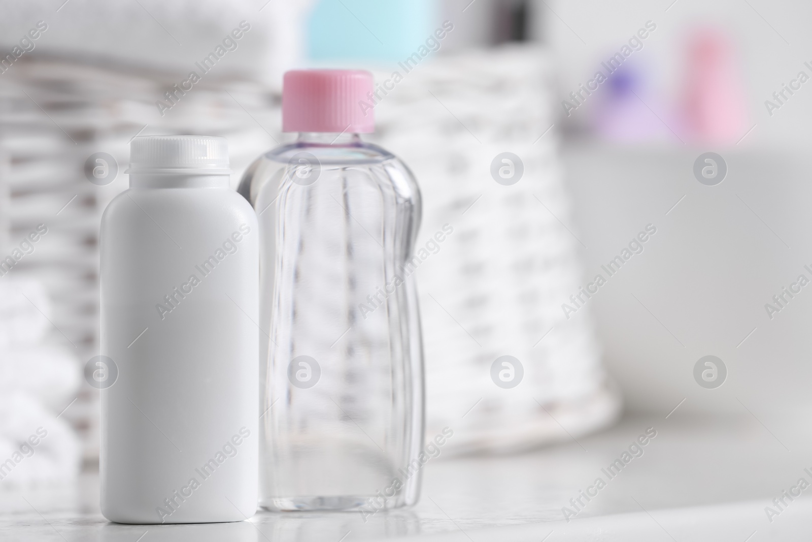 Photo of Baby cosmetic products on white table, space for text