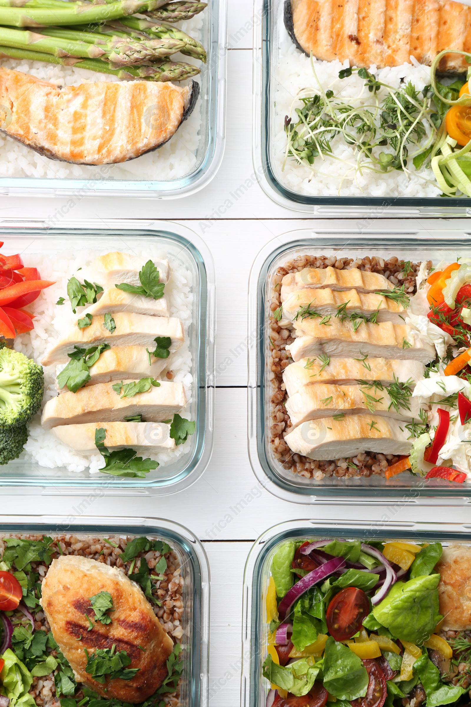 Photo of Healthy meal. Containers with different products on white wooden table, flat lay