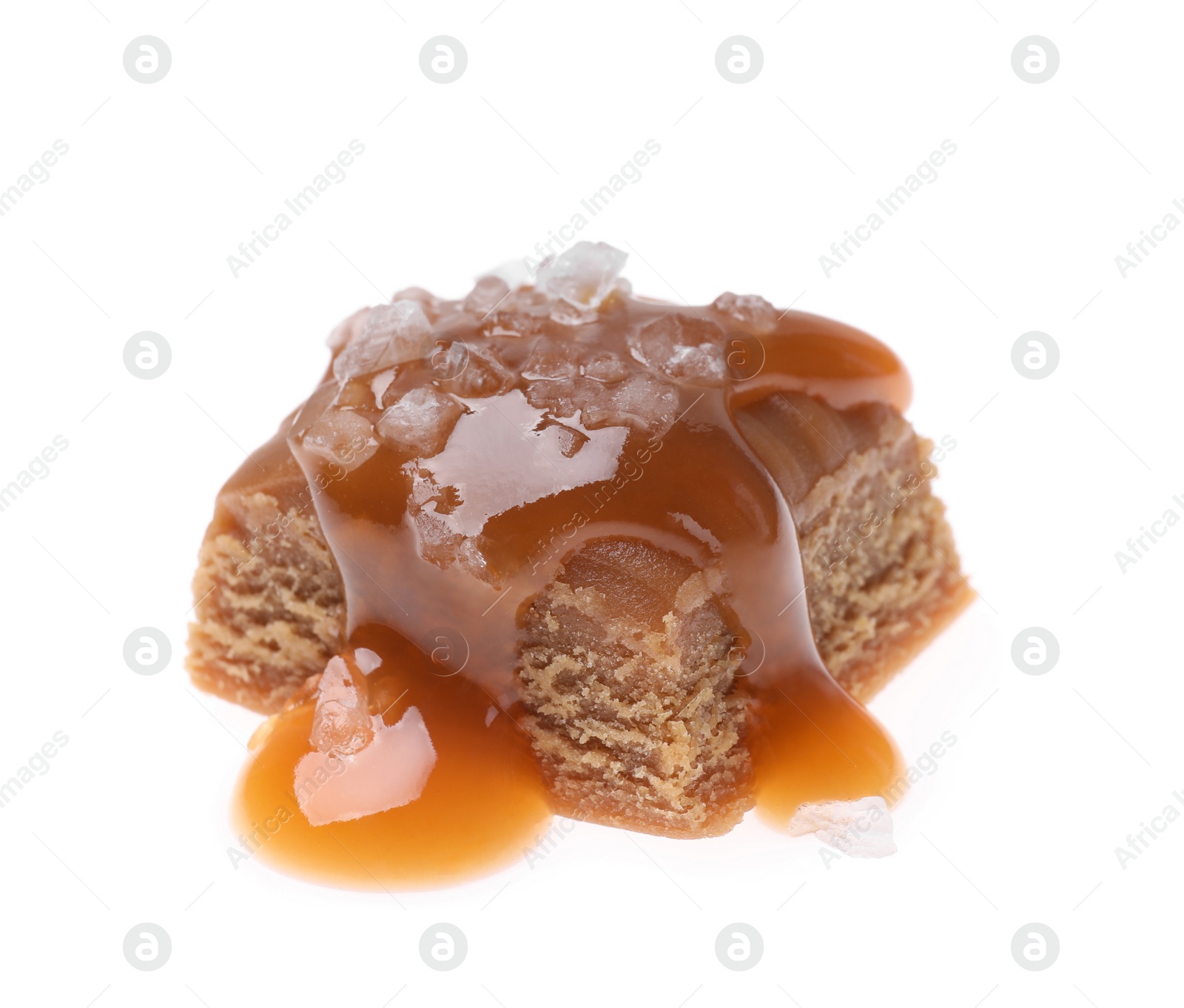 Photo of Delicious salted caramel with sauce on white background